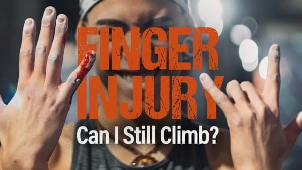Chalky hands held up, one fingertip bleeding, with a climber's smiling face blurred behind them