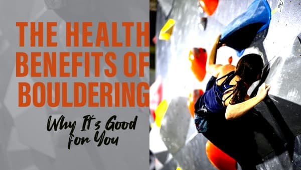 Woman in a navy tank top climbs a steep indoor wall covered in colorful holds