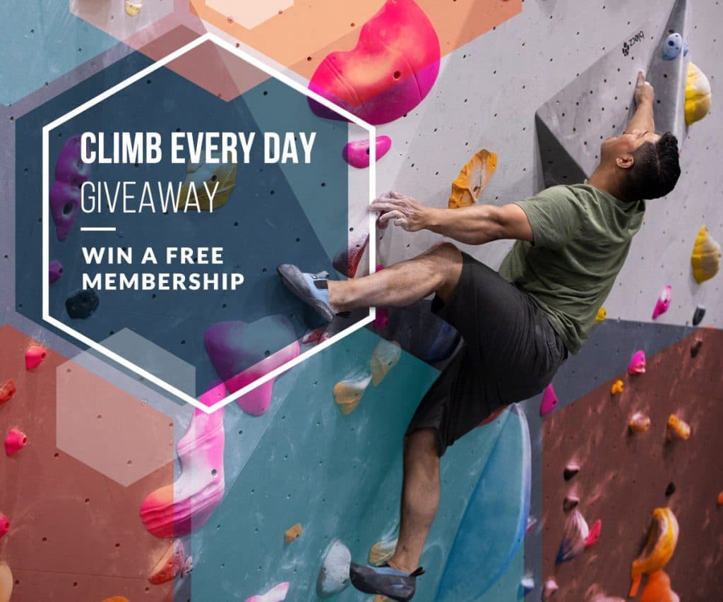 A man in a green shirt climbs a steep wall, with Climb Every Day Giveaway, Win a Free Membership text