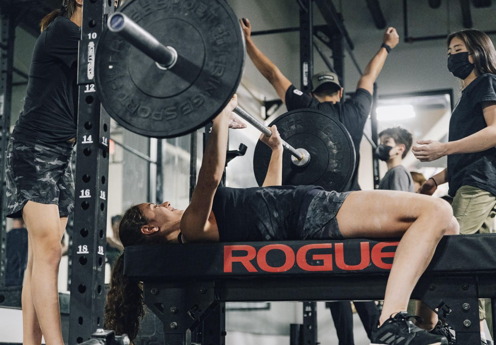 Member bench pressing in the weight area